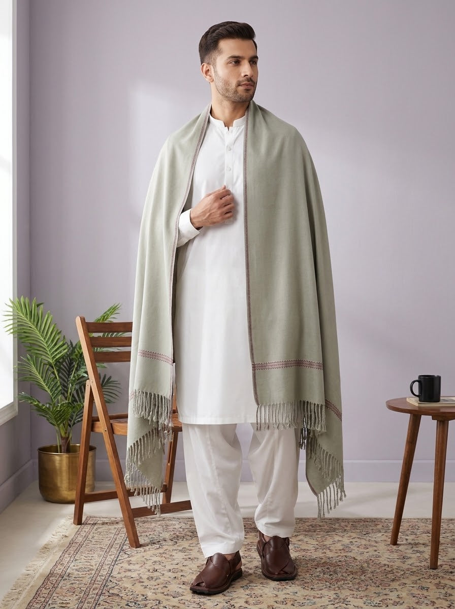 Man wearing J. sage grey wool shawl